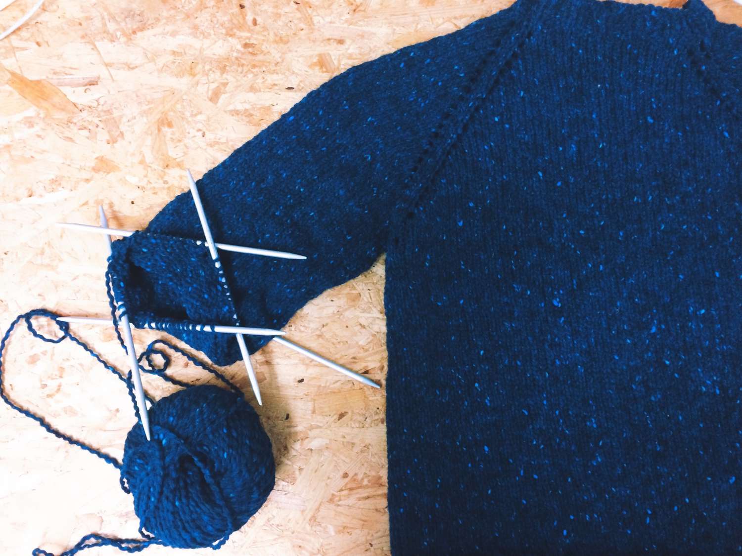 close-up-of-ball-of-wool-with-knitting-needles-and-sweater-533789933-57c740973df78c71b61647c7.jpg